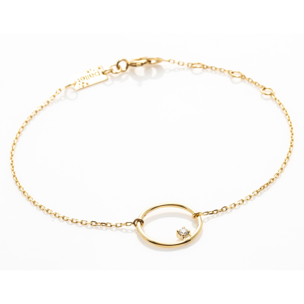le Bracelet or jaune 375/1000, motif rond avec 1 diamant de 0,03 carat, by Stauffer